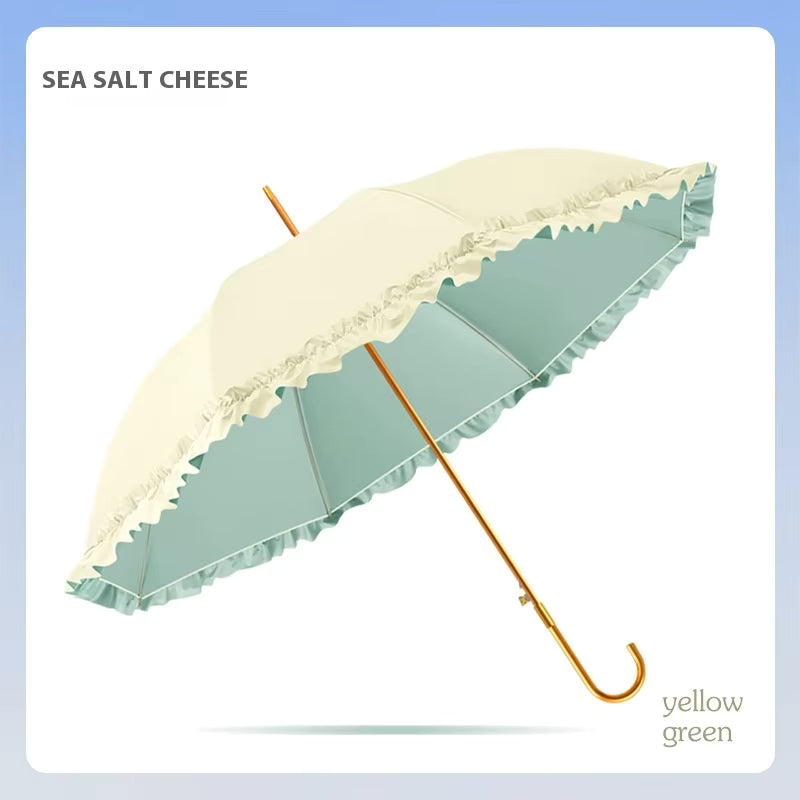 Umbrella with cream and yellow-green canopy on a light blue background