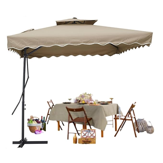 Beige patio umbrella with a table and chairs underneath on a white background
