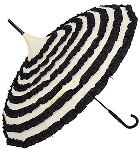 Black and white striped umbrella with ruffled frill on a white background