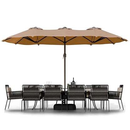 Outdoor furniture set with a large beige umbrella on a white background