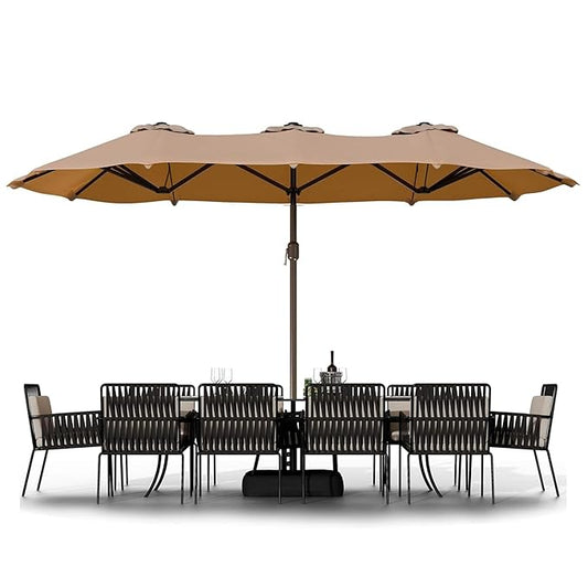 Outdoor furniture set with a large beige umbrella on a white background