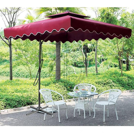 Red patio umbrella with a table and chairs in a garden setting