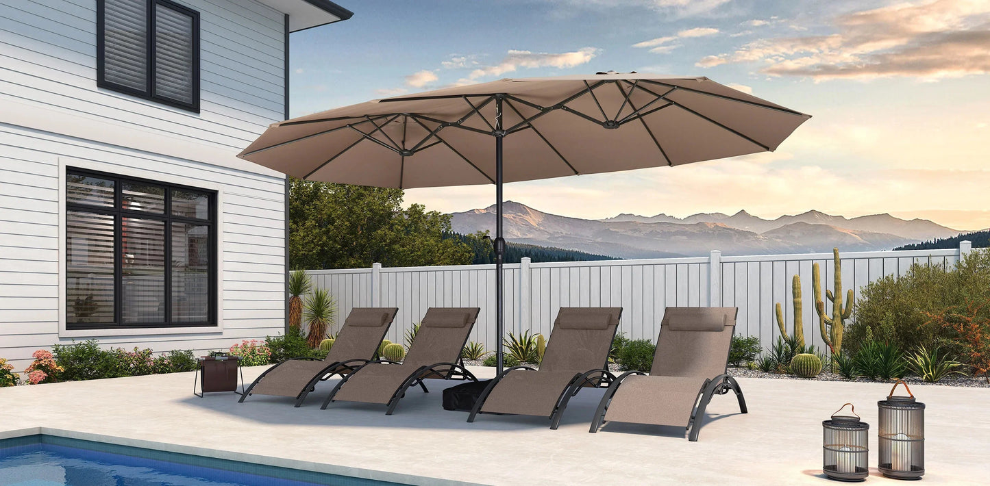 Beige patio umbrella over lounge chairs by a pool with a scenic background